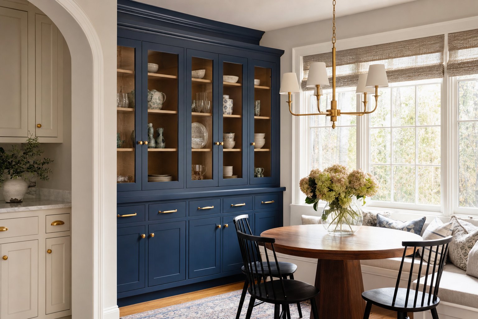 Arched blue built-in cabinet with glass doors