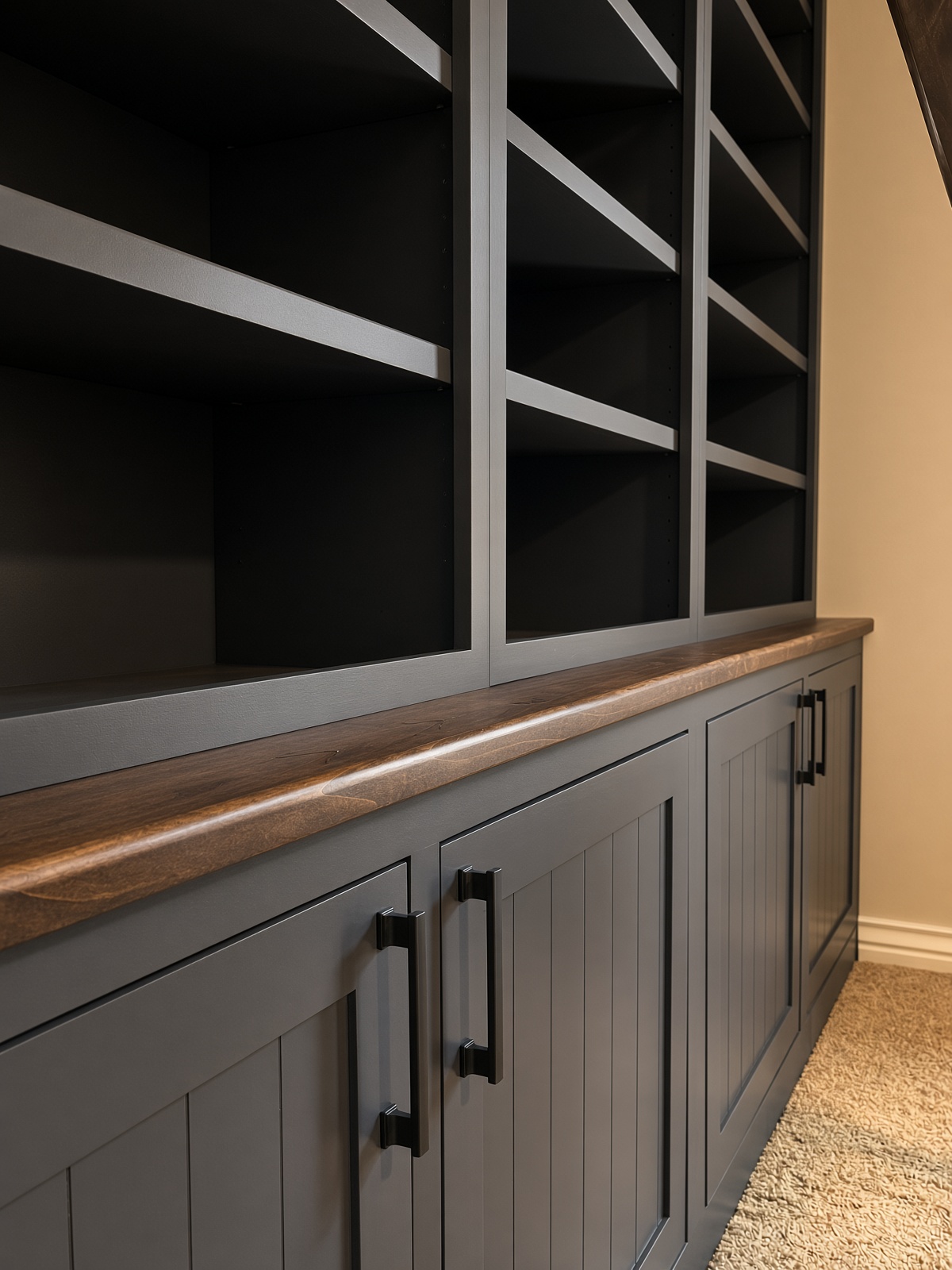 Charcoal shaker-style built-in cabinetry with dark wood countertop