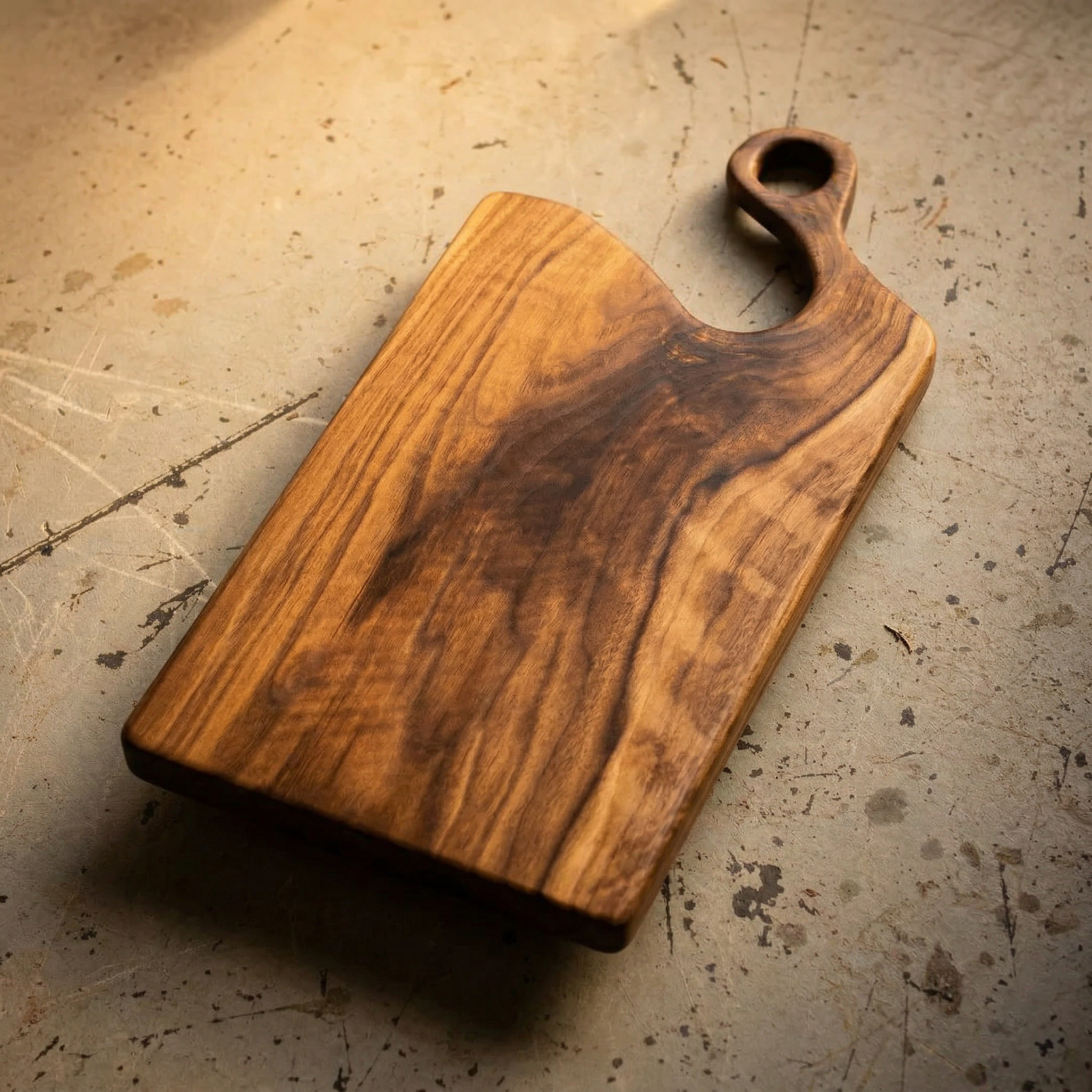 Cherry wood board with organic curved handle