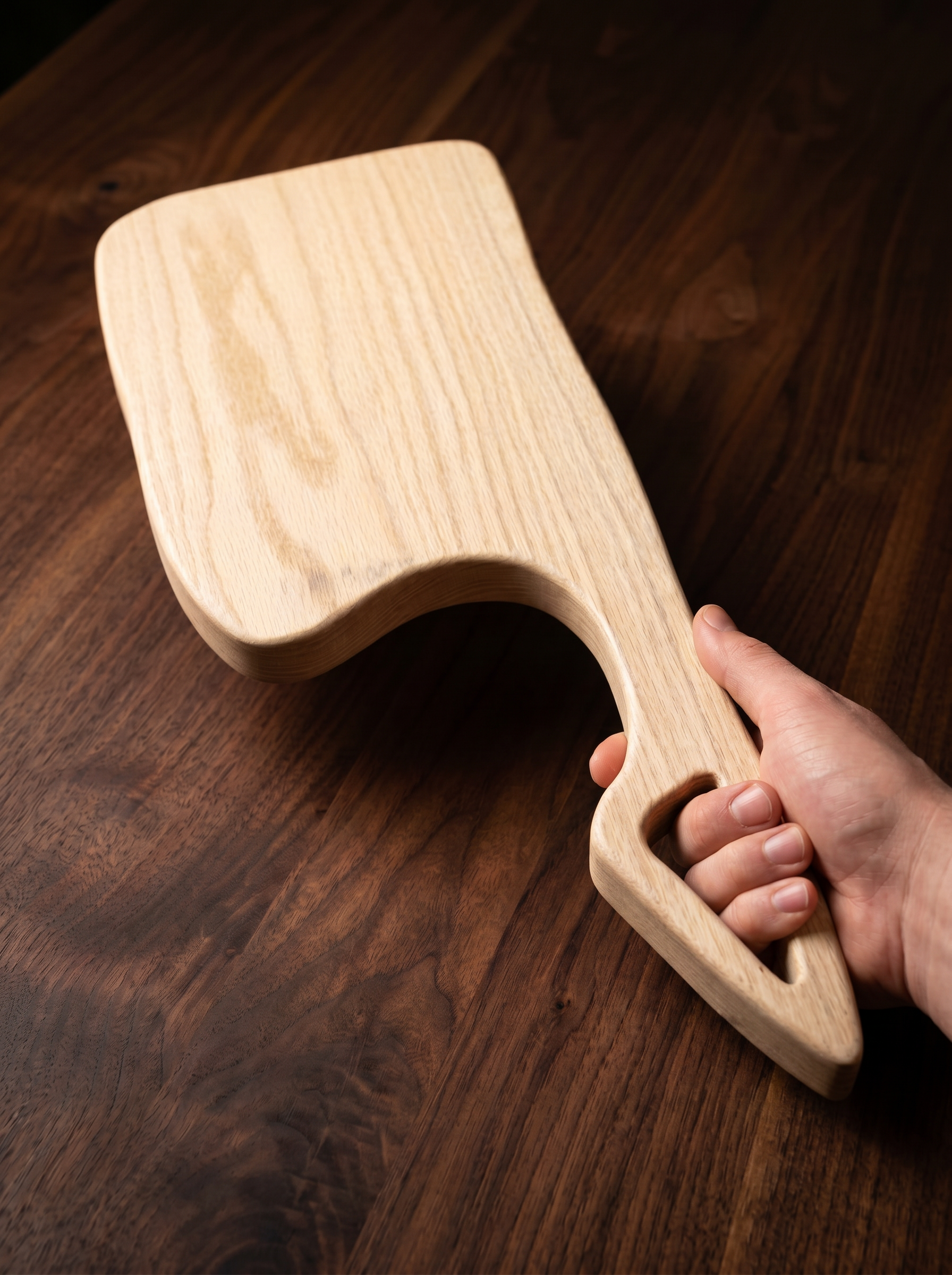 Handcrafted wood serving board with cleaver-inspired handle