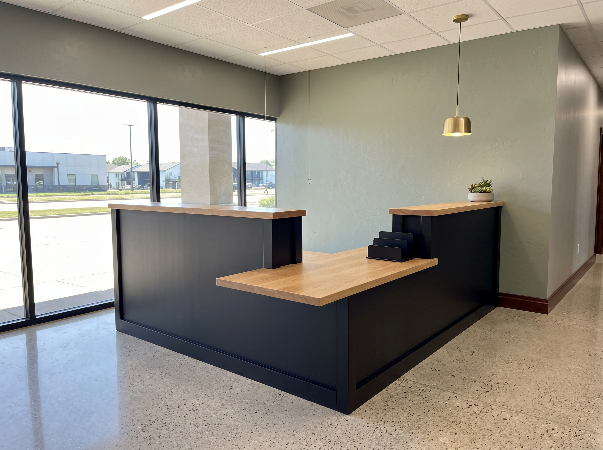 L-shaped reception desk with natural wood and black base