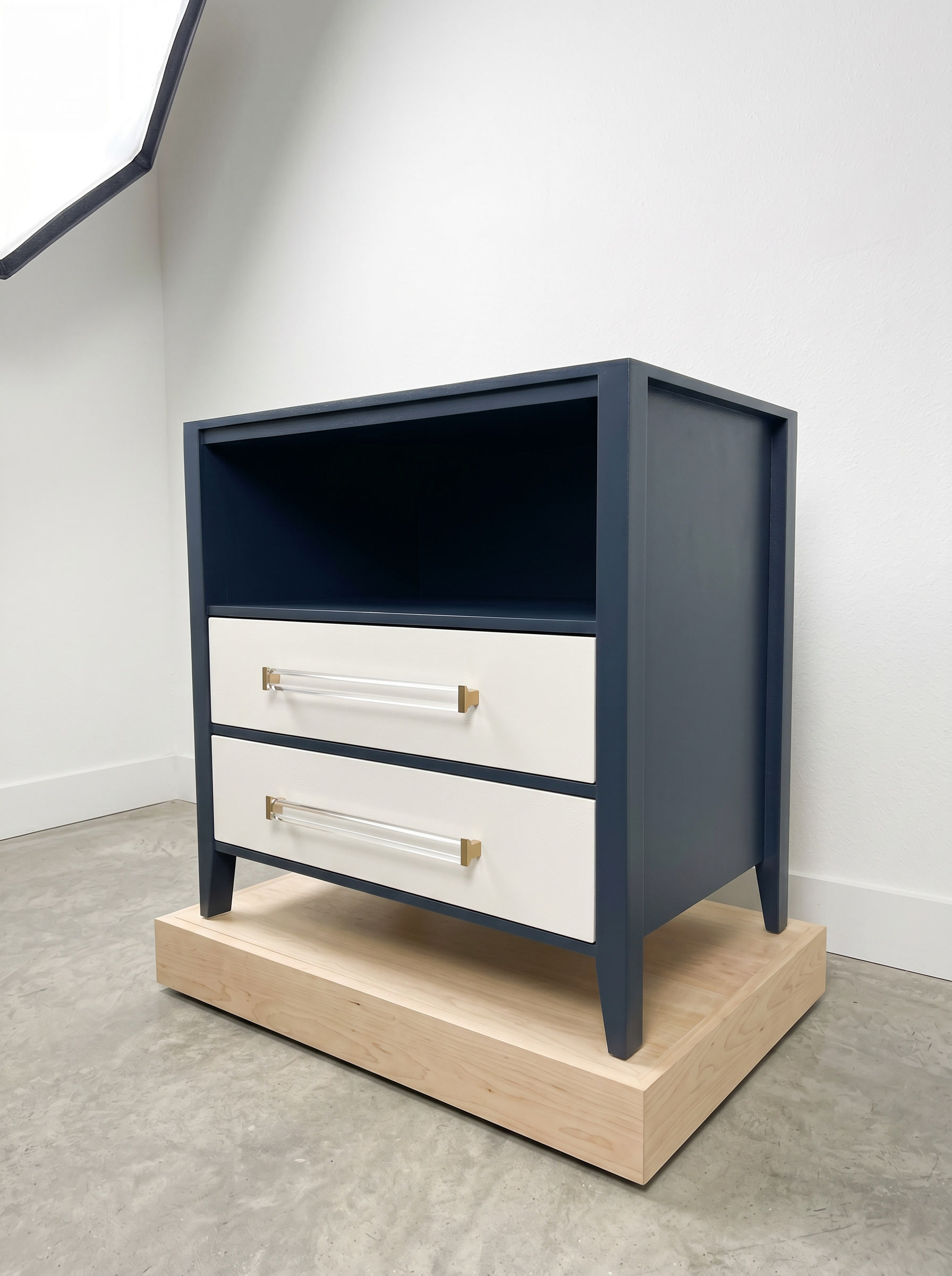 Navy and white two-tone nightstand with brass handles