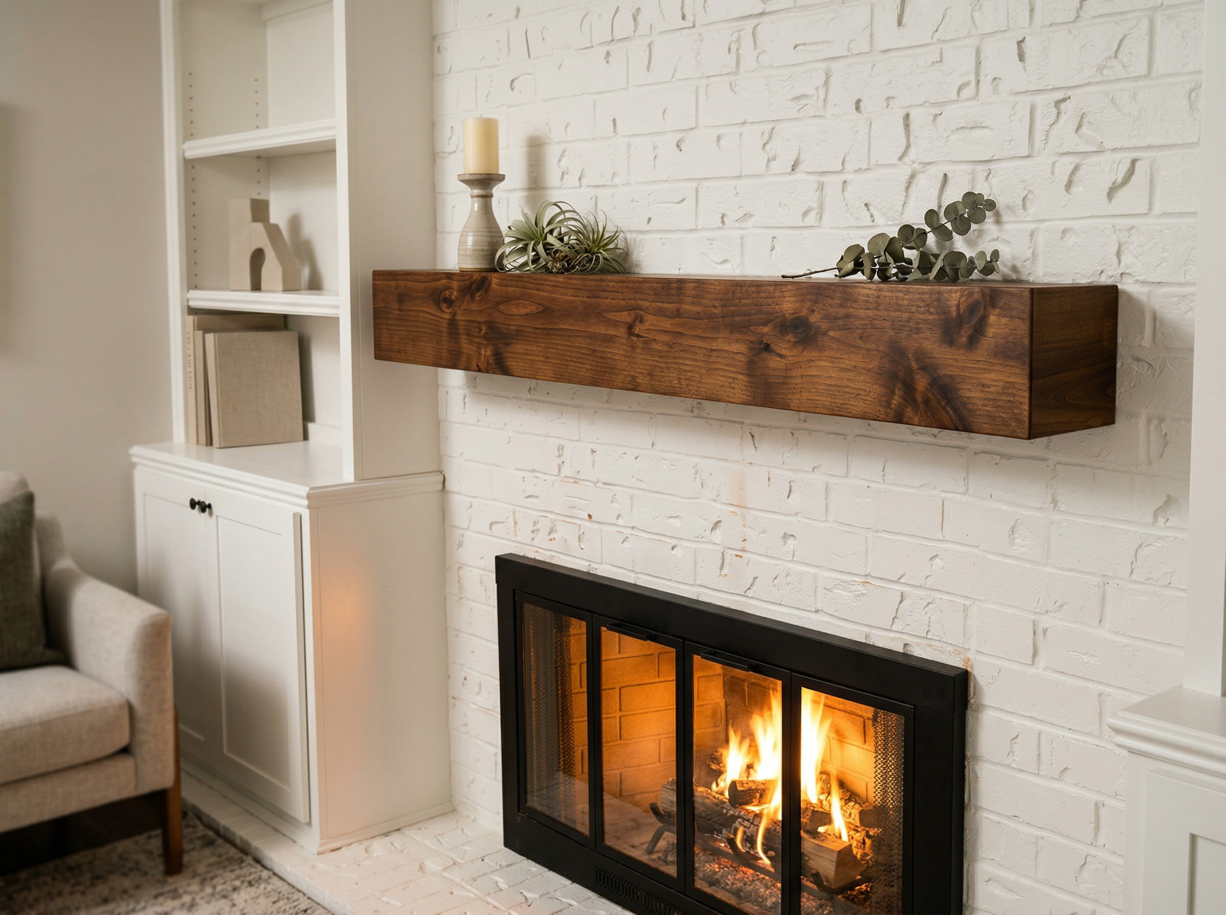Walnut fireplace mantel on white brick wall