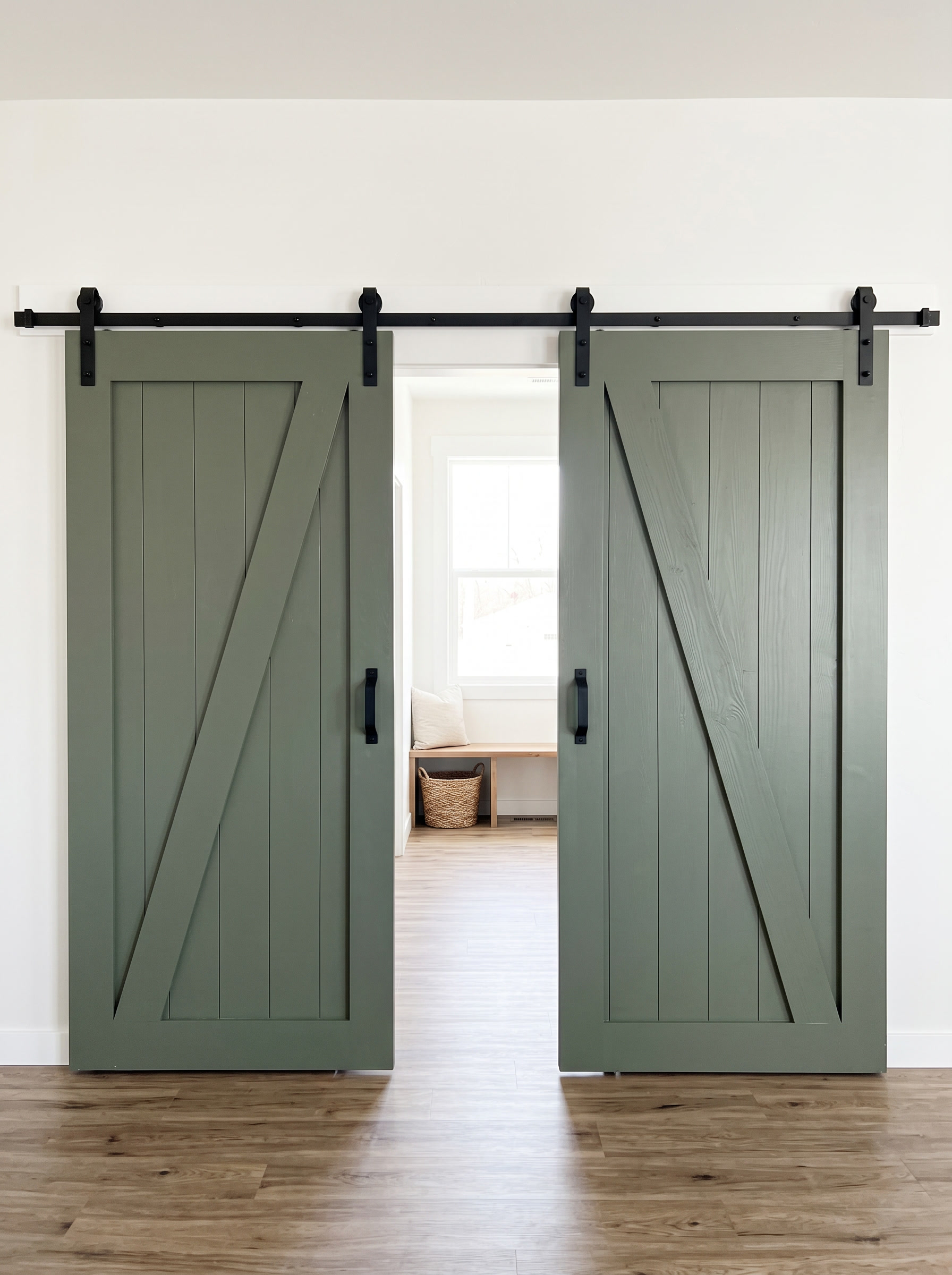 Green painted double barn doors with Z-brace design